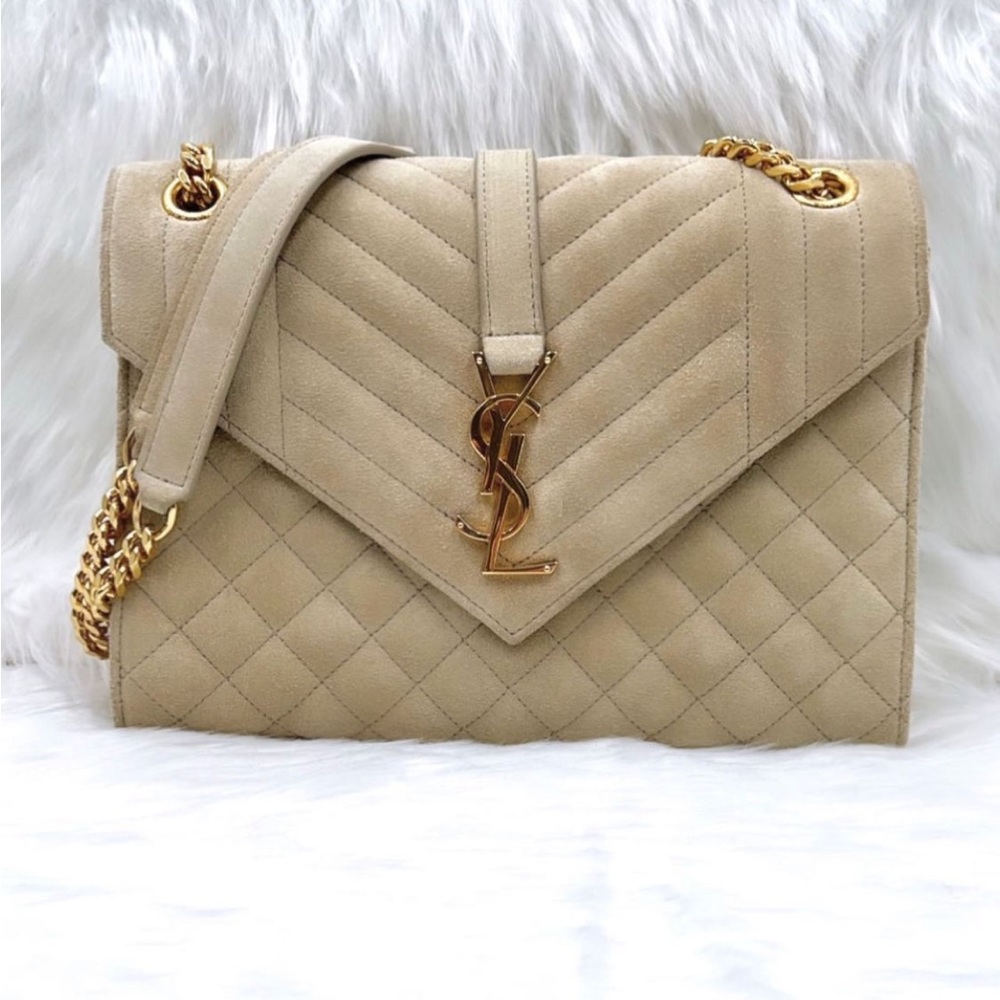 Brand new quilted suede YSL purse.